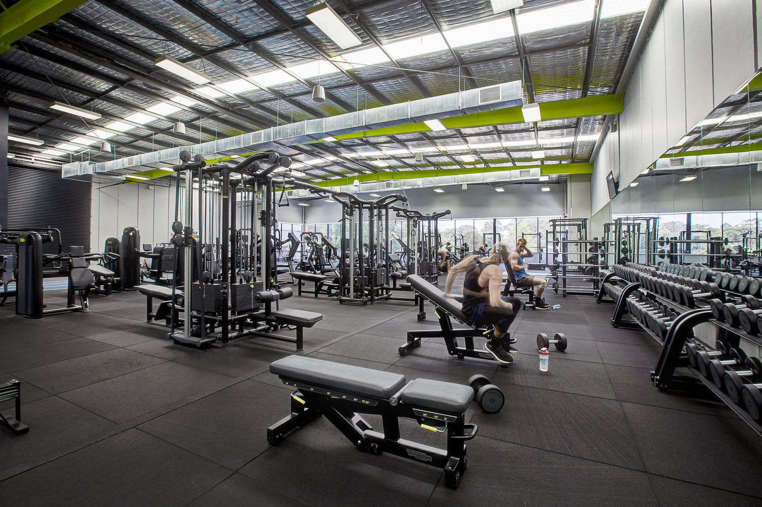 A modern gym full of exercise machines.