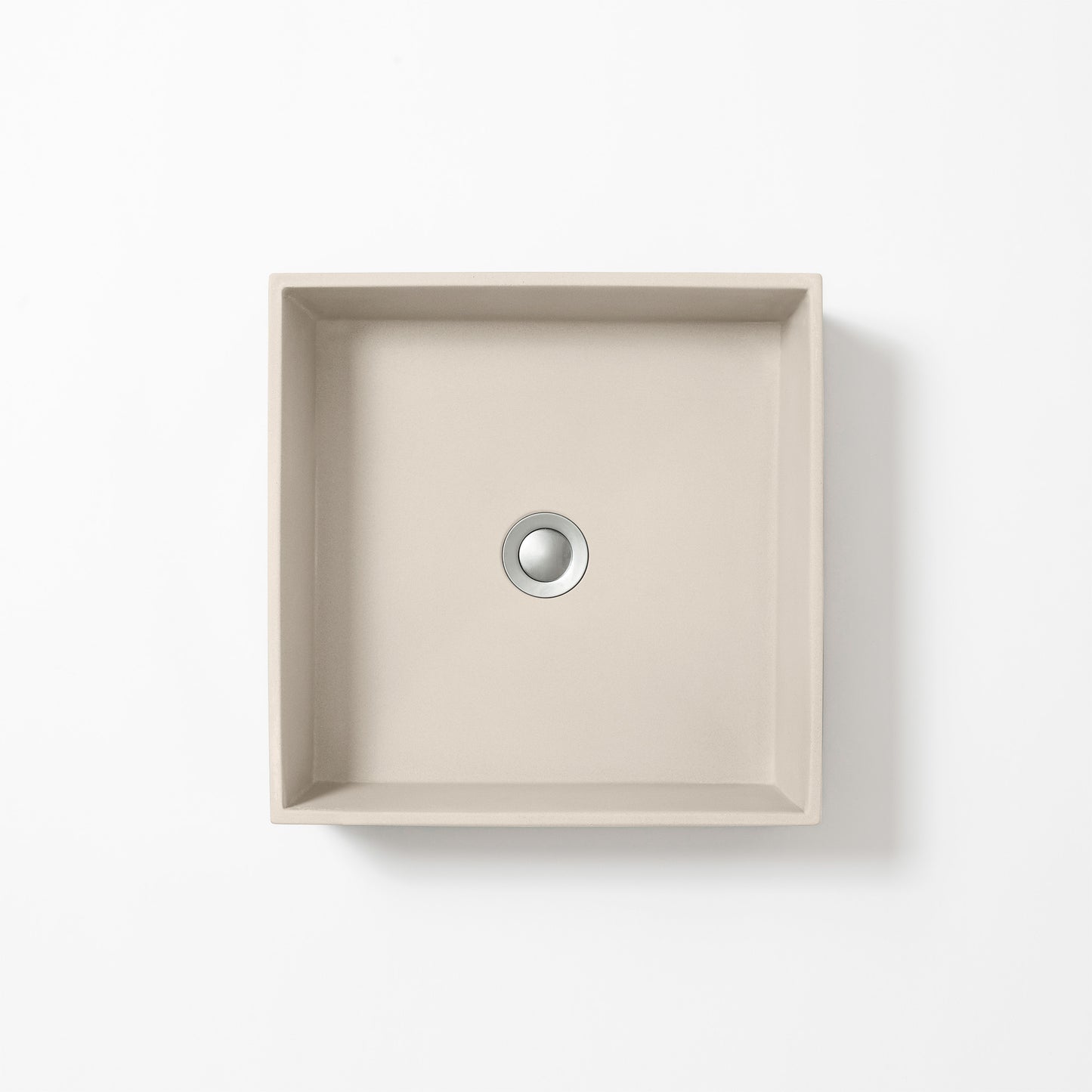 Square concrete basin in Husk, a light beige-grey with soft sand tones, shown from above against a white background.