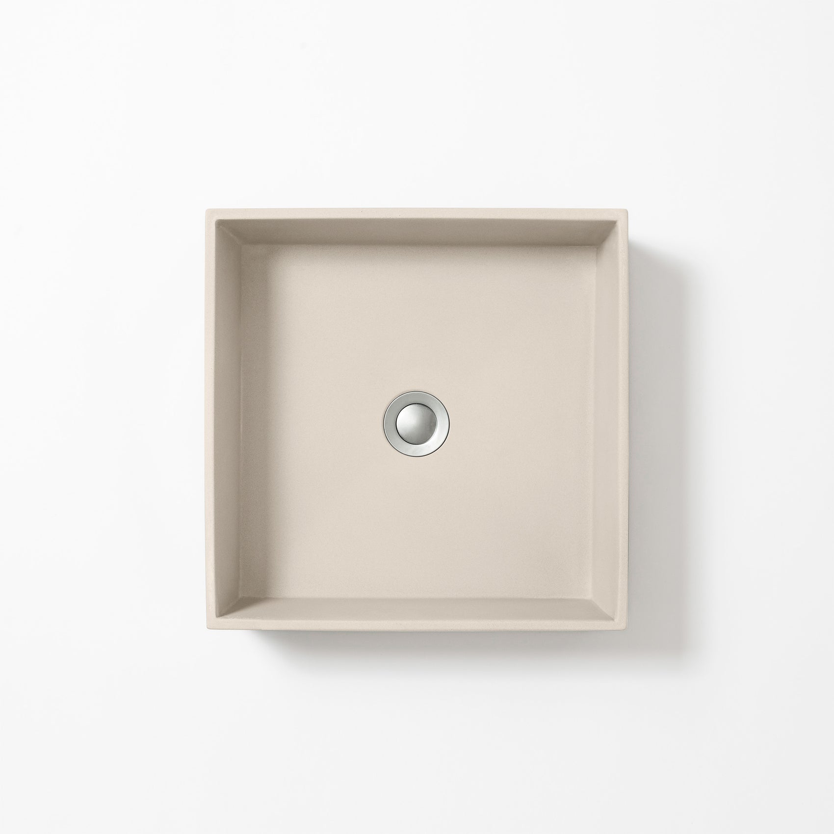 Square concrete basin in Husk, a light beige-grey with soft sand tones, shown from above against a white background.