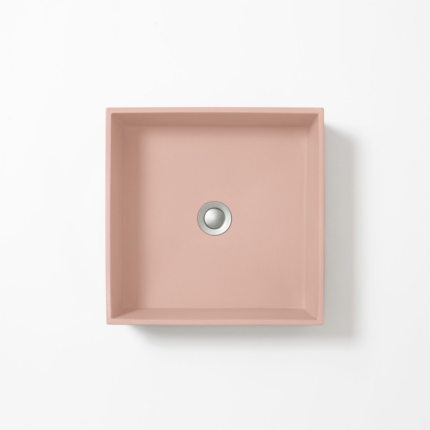 Square concrete basin in Rose, a soft dusty pink with subtle grey undertones, shown from above against a white background.