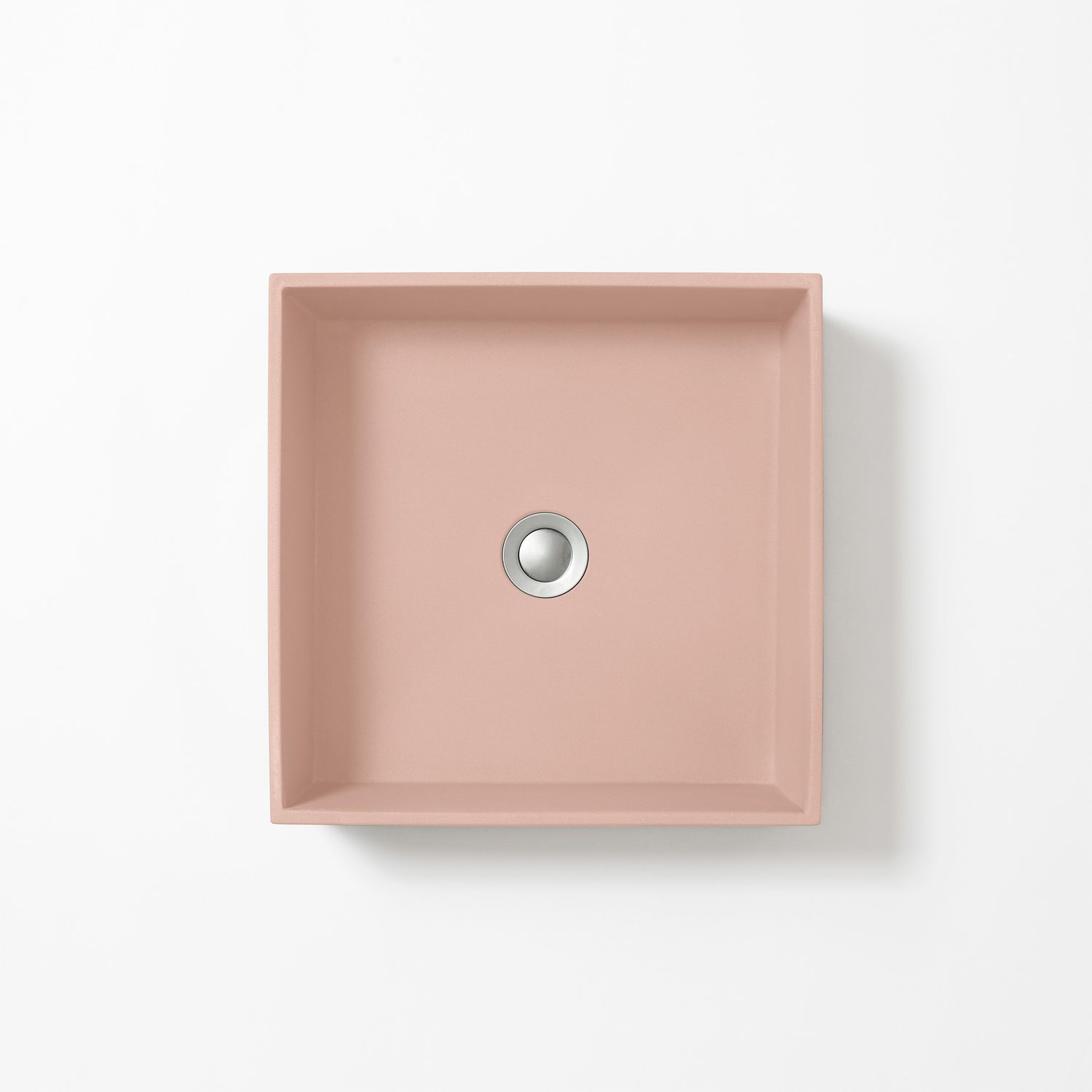 Square concrete basin in Rose, a soft dusty pink with subtle grey undertones, shown from above against a white background.