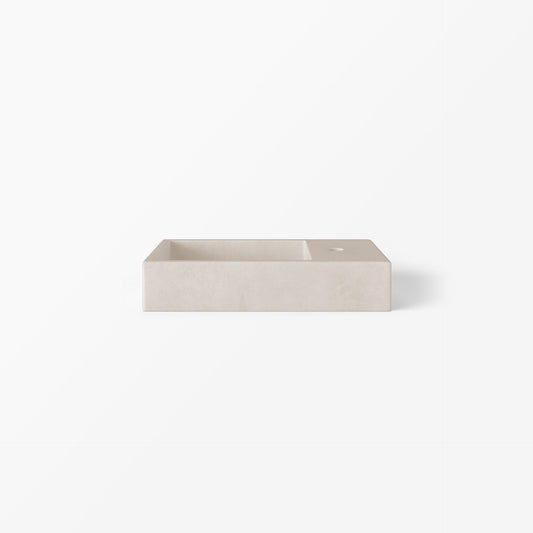 Weerlito mini rectangle concrete basin in Husk, a calm pale stone tone with gentle warmth, shown from a front angle.