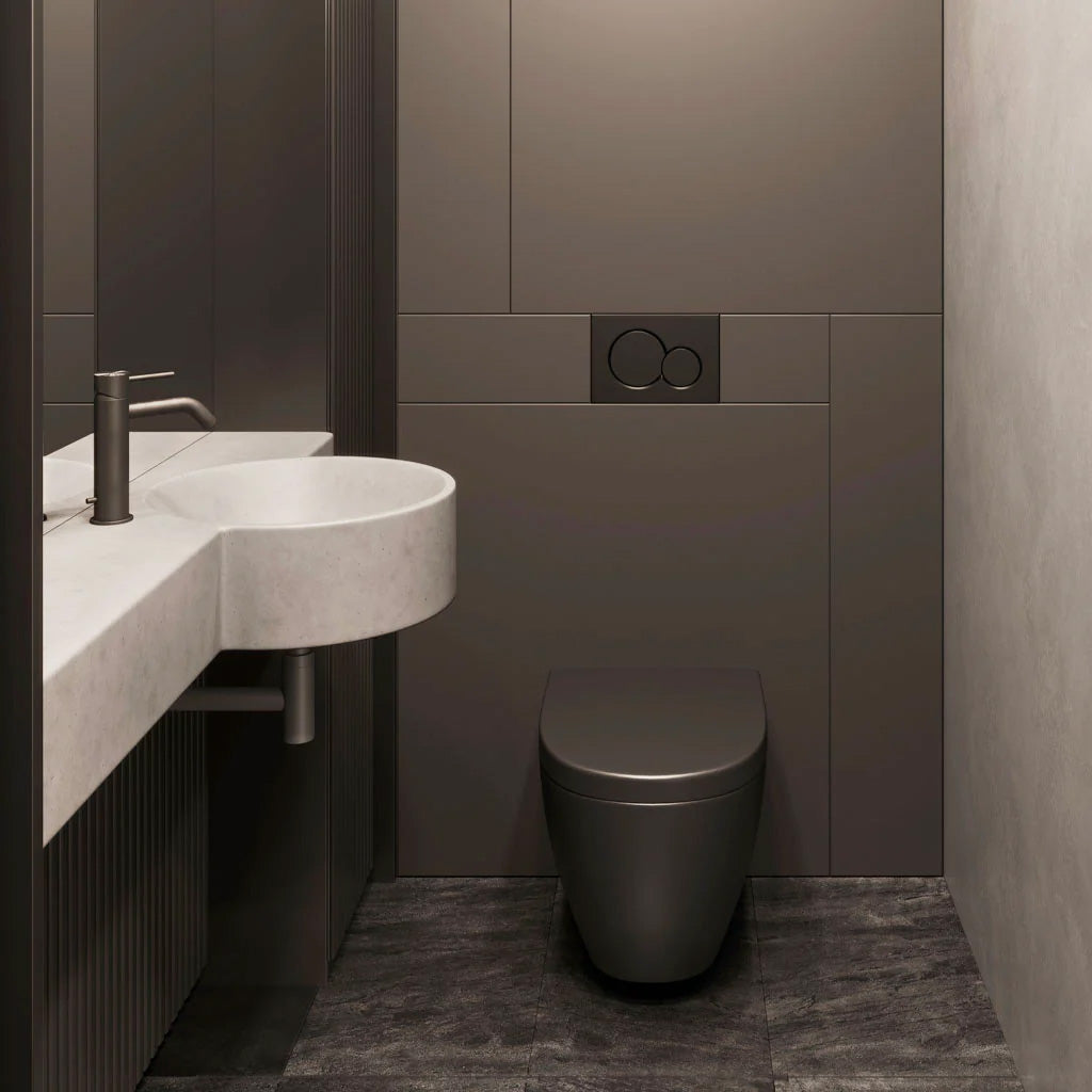 A slim semi-recessed concrete vanity with integrated sink in a modern bathroom with moody tiles.