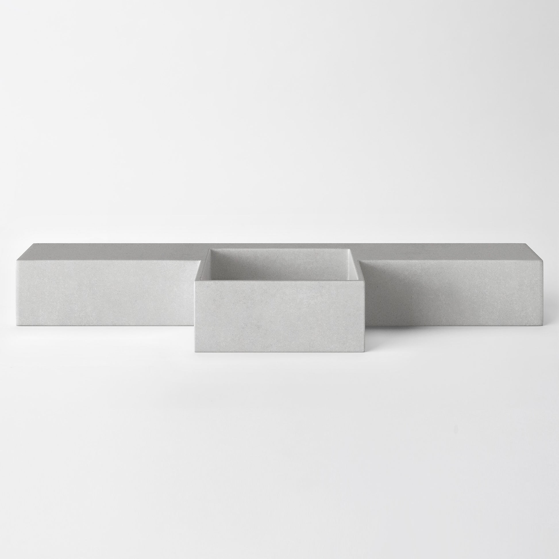 Baly Semi-recessed concrete vanity, wall-mounted without brackets. Slim 200 mm profile with an integrated cylindrical basin, hand-cast in GFRC concrete for a smooth, matte finish. Designed for tight spaces, the seamless surface prevents water pooling and creates a refined, minimalist look. 