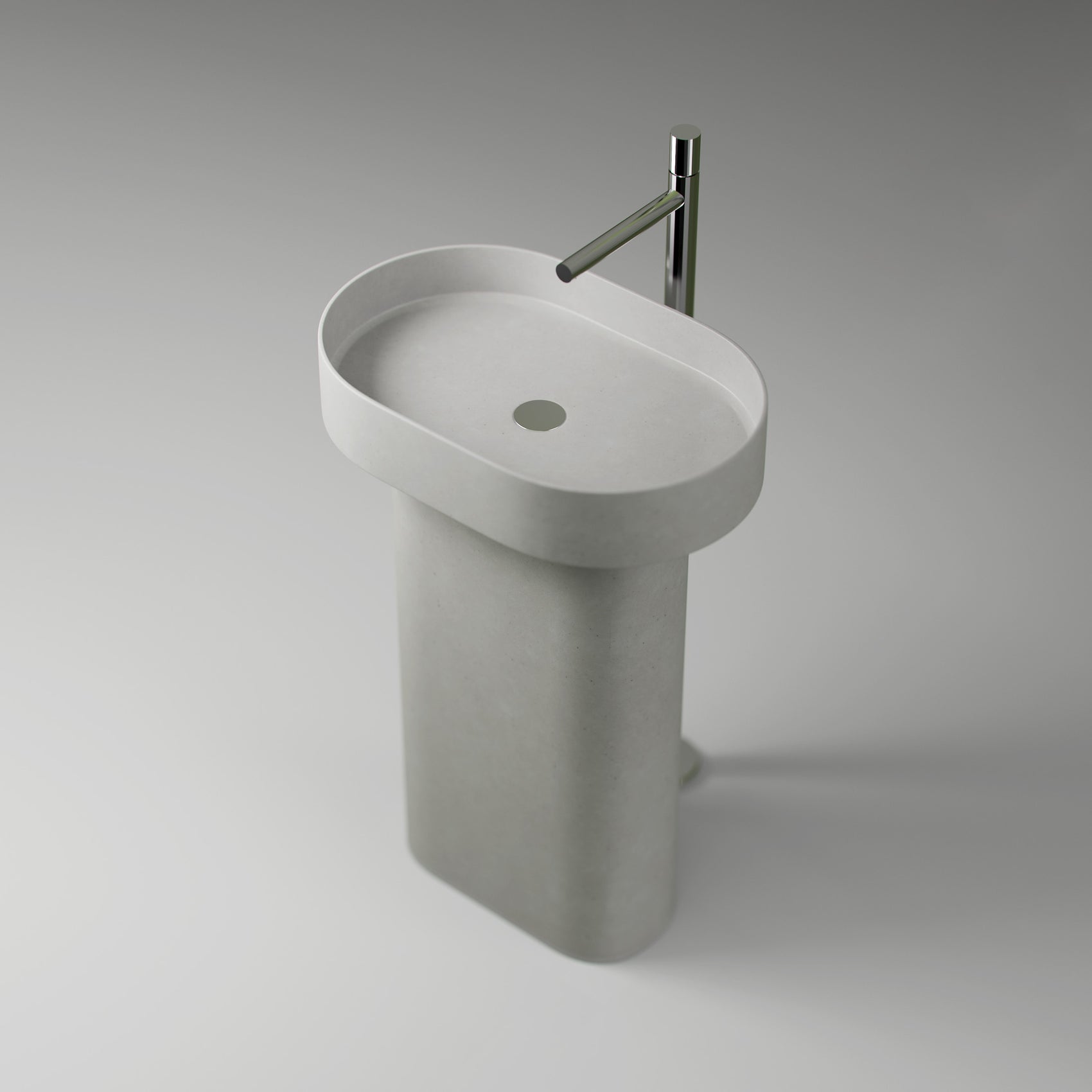 Three-quarter top-down view of the Bilya concrete pedestal basin, showing the full pedestal, the integrated oblong sink, and a floor-mounted mixer tap.