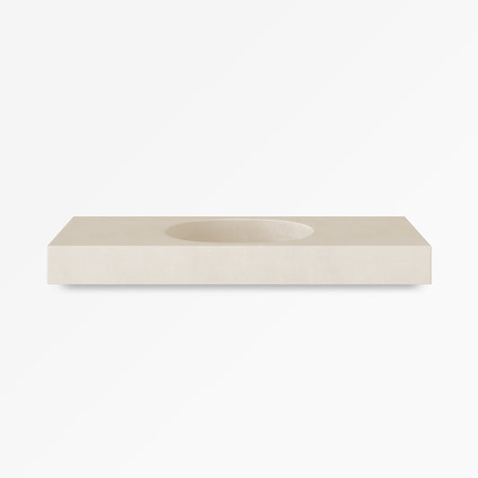 Bilya single concrete vanity in Husk, a warm pale grey, shown with a straight-sided integrated oblong basin for use as a wall-mounted bathroom sink.